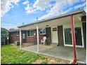 Relaxing backyard patio with sliding glass doors and well-maintained brick exterior at 13024 E Alaska Pl, Aurora, CO 80012