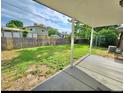 Spacious backyard with lush green lawn and mature trees perfect for outdoor activities at 13024 E Alaska Pl, Aurora, CO 80012