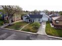 An aerial shot of a home with a well-kept lawn and mature landscaping in a quiet residential neighborhood at 2728 N Yates St, Denver, CO 80212