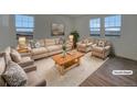 Bright living room featuring a beige sectional sofa and two armchairs, creating a cozy gathering space at 12892 E 99Th Pl, Commerce City, CO 80022