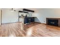 Spacious living room featuring new flooring, bar seating and a fireplace at 695 Manhattan Dr # 109, Boulder, CO 80303