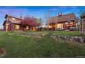 Expansive backyard featuring well-kept lawn and lovely, mature landscaping at 11689 Caribou Dr, Franktown, CO 80116