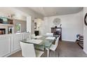 Open dining area with modern decor, seamless flow to the living room, and ample natural light at 19917 Mitchell Cir, Denver, CO 80249