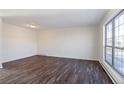 Simple living room with wood-look floors and large window at 3124 W 9Th Avenue Pl, Broomfield, CO 80020