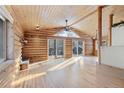 Spacious living room with vaulted ceilings, wood floors, and large windows at 721 Aspen Way, Evergreen, CO 80439