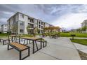 A well-maintained community area with picnic tables and BBQ grill, ideal for outdoor gatherings at 6153 N Ceylon St # 2-202, Denver, CO 80249