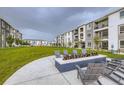 Inviting community firepit area with comfortable seating, perfect for relaxing outdoors at 6153 N Ceylon St # 2-202, Denver, CO 80249