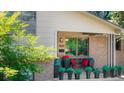 Inviting front porch with brick columns and potted plants at 4600 W Princeton Ave, Denver, CO 80236