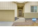 Close up of a home entrance with a covered entryway, garage, and available sign at 4102 Estrella St, Brighton, CO 80601