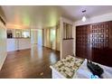 Open-concept living room with hardwood floors, large windows, and natural light, creating a bright and inviting space at 7245 S Dexter St, Centennial, CO 80122