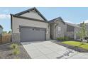 Beautifully landscaped home showcasing its stone and siding facade, two-car garage, and modern design at 5905 S Platte Canyon Dr, Littleton, CO 80123