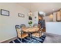 Charming dining area with table and chairs near kitchen at 12704 Jasmine St # E, Thornton, CO 80602