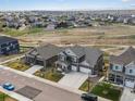 An aerial view of a two-story home in a residential neighborhood at 8346 E 132Nd Dr, Thornton, CO 80602
