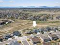 An aerial view of a two-story home in a residential neighborhood at 8346 E 132Nd Dr, Thornton, CO 80602