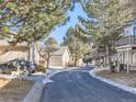 Residential community with paved roads and mature trees at 9633 Brentwood Way # B, Broomfield, CO 80021