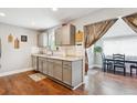 Classic kitchen with gray cabinets, granite countertops, and stainless steel appliances at 6055 E Minnesota Dr, Denver, CO 80224