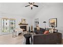 Cozy living room featuring a fireplace, plush seating, and a sliding glass door to a balcony at 6755 S Field St # 625, Littleton, CO 80128