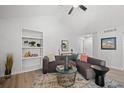 Bright living room showcasing modern decor, built-in shelving, and comfortable seating area at 6755 S Field St # 625, Littleton, CO 80128