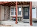 Inviting entryway with brick pillars, seating area, and well-maintained exterior at 1128 S Ventura Cir # K, Aurora, CO 80017