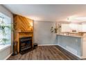 Comfortable living area with a fireplace, and an open layout to the kitchen at 1128 S Ventura Cir # K, Aurora, CO 80017