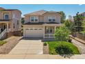 Charming two-story home with a spacious front porch, a well-manicured lawn, and a two-car garage at 2354 Cactus Bloom Ct, Castle Rock, CO 80109