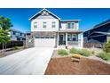 Attractive two story home with a well kept lawn and two-car garage at 129 S Waterloo St, Aurora, CO 80018