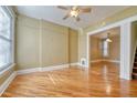 Bright living room featuring hardwood floors, neutral paint, and views to the dining area at 707 27Th St, Denver, CO 80205