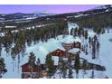 Luxury mountain home with snow covered roof at 457 Timber Trail Rd, Breckenridge, CO 80424