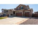 Charming two-story home featuring a three-car garage and a well-maintained front yard at 1334 Barberry Trl, Elizabeth, CO 80107