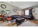 Relaxing living room with a collection of photos and decor at 1418 5Th St, Fort Lupton, CO 80621