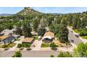 Aerial view of home with mountain views, detached garage and RV parking at 403 Anderson St, Castle Rock, CO 80104