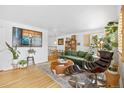 Stylish living room with hardwood floors, modern furniture, and ample natural light and decor at 1335 Jasmine St, Denver, CO 80220