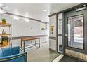 Apartment lobby with clean white walls and a view to the outdoors at 1833 N Williams St # 201, Denver, CO 80218