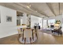 Open living space with concrete ceilings, modern furnishings, and dining area at 1888 S Jackson St # 708, Denver, CO 80210