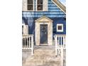Close-up of the front door with decorative wreath, complemented by stylish columns and a welcoming entrance at 5103 Quitman St, Denver, CO 80212