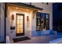 Close-up of front entrance showcasing a modern door, lighting, and architectural details at 1120 S Gaylord St, Denver, CO 80210