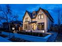 Charming two-story home with manicured front yard, featuring a modern exterior and inviting entrance at 1120 S Gaylord St, Denver, CO 80210