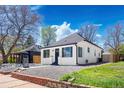 Beautifully renovated home showcasing manicured, low-maintenance front yard with gravel landscaping and a freshly painted exterior at 4745 N Clay St, Denver, CO 80211