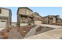 Charming two-story home with front porch and a well-manicured front yard at 5038 Blue Lunar Ln, Castle Rock, CO 80104