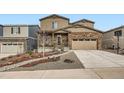 Charming two-story home with stone accents, covered porch, and well-maintained landscaping at 5038 Blue Lunar Ln, Castle Rock, CO 80104