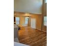 Bright living room with hardwood floors, high ceilings, and large windows, offering abundant natural light at 23014 Milford Ln, Parker, CO 80138