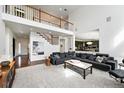 Spacious living room with high ceilings, and an open floor plan, perfect for entertaining at 11985 Singing Winds St, Parker, CO 80138