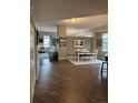 Open dining area featuring hardwood floors, neutral paint, and modern lighting at 475 W 12Th Ave # 4E, Denver, CO 80204