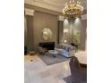 Relaxing luxury building lobby lounge area with a decorative fireplace and marble floors at 475 W 12Th Ave # 4E, Denver, CO 80204