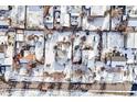 Aerial view of a neighborhood with snow covered homes at 11842 W 14Th Ave, Lakewood, CO 80401