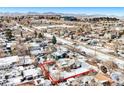 Aerial view showing house and lot in winter setting at 11842 W 14Th Ave, Lakewood, CO 80401