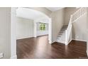 Bright living room showcasing hardwood floors and stairway leading to the upper level at 3520 Desert Ridge Cir, Castle Rock, CO 80108