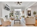 Inviting living room with large window, neutral tones, and hardwood flooring at 748 Elati St, Denver, CO 80204