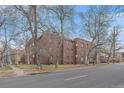 Charming three-story brick building with mature trees and street view at 1410 Vine St # 1, Denver, CO 80206