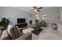 Cozy living room featuring hardwood floors, comfortable seating, and a ceiling fan at 1410 Vine St # 1, Denver, CO 80206